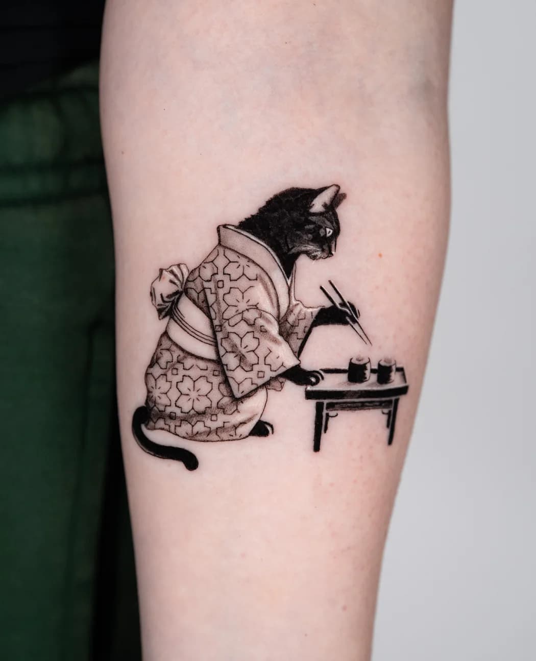 Cat in a kimono working at a low writing desk