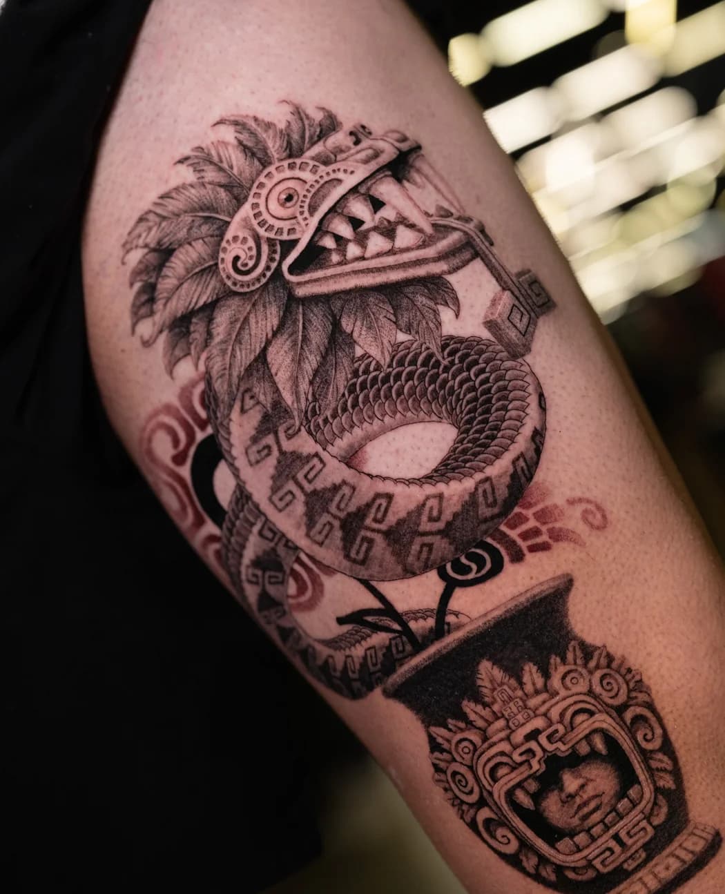 K'uk'ulkan Dragon coiled over an ornamental vessel on an upper arm