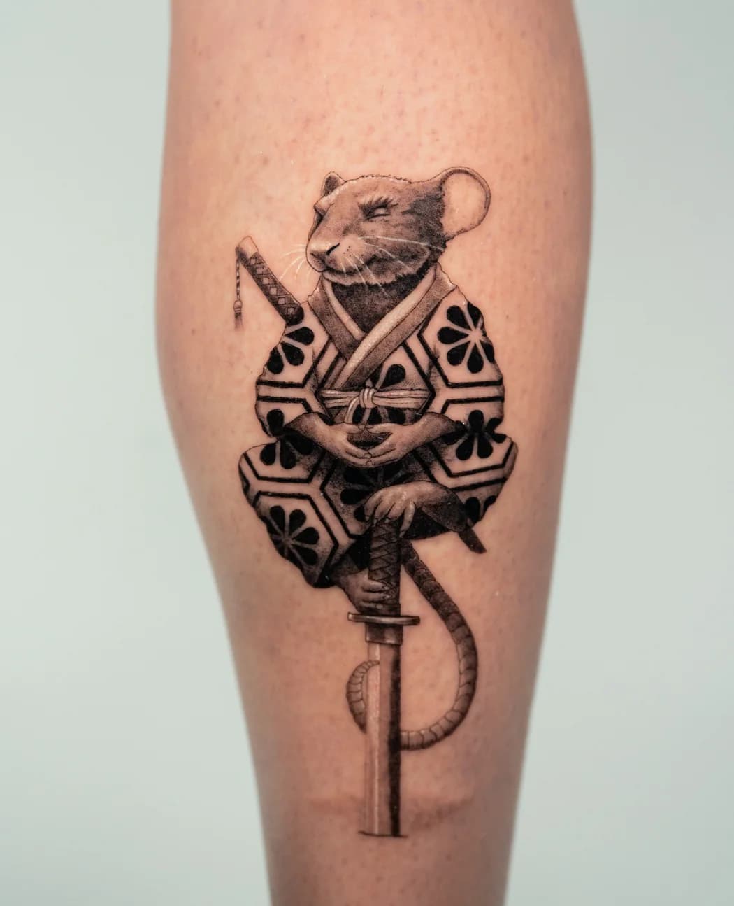 Armoured mouse standing on an old key