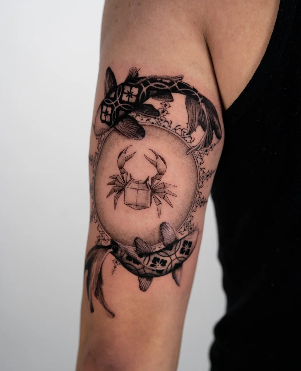 Scarab set in an ornamental frame on an upper arm